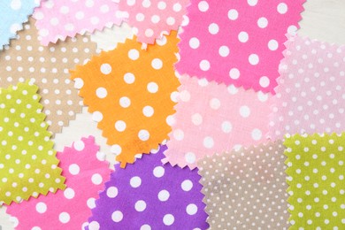 Photo of Samples of different fabrics on white wooden table, flat lay