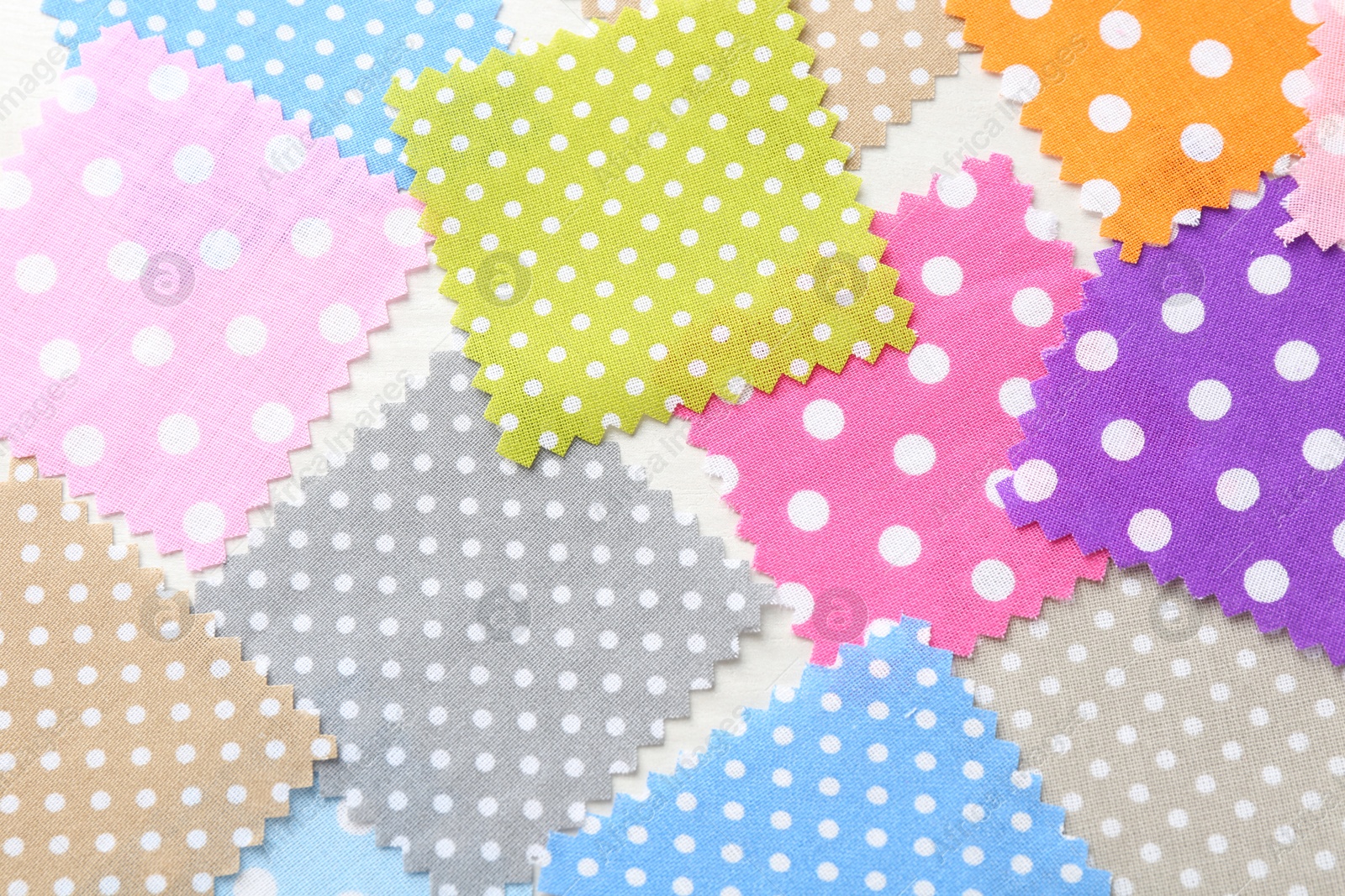 Samples of different fabrics on white wooden table, flat lay Photo of Samples of different fabrics on white wooden table, flat lay