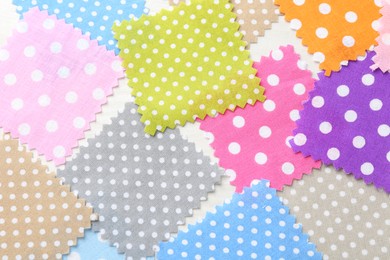 Photo of Samples of different fabrics on white wooden table, flat lay