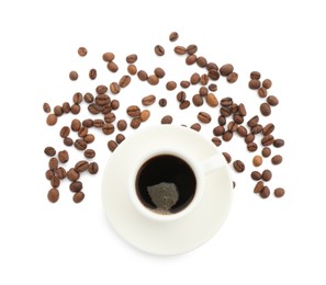 Photo of Aromatic coffee in cup and beans isolated on white, top view