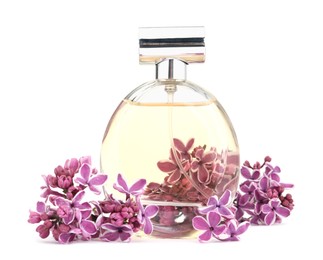 Photo of Bottle of luxury perfume and lilac flowers isolated on white