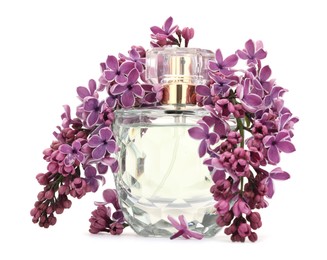 Photo of Bottle of luxury perfume and lilac flowers isolated on white