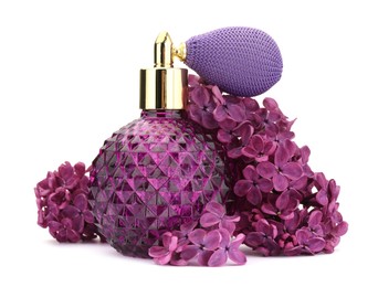 Photo of Bottle of luxury perfume and lilac flowers isolated on white