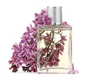 Photo of Bottle of luxury perfume and lilac flowers isolated on white