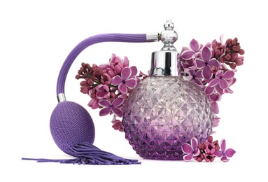 Photo of Bottle of luxury perfume and lilac flowers isolated on white