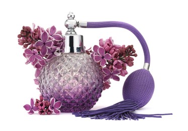 Photo of Bottle of luxury perfume and lilac flowers isolated on white