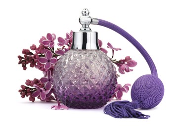 Photo of Bottle of luxury perfume and lilac flowers isolated on white