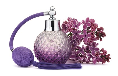 Photo of Bottle of luxury perfume and lilac flowers isolated on white