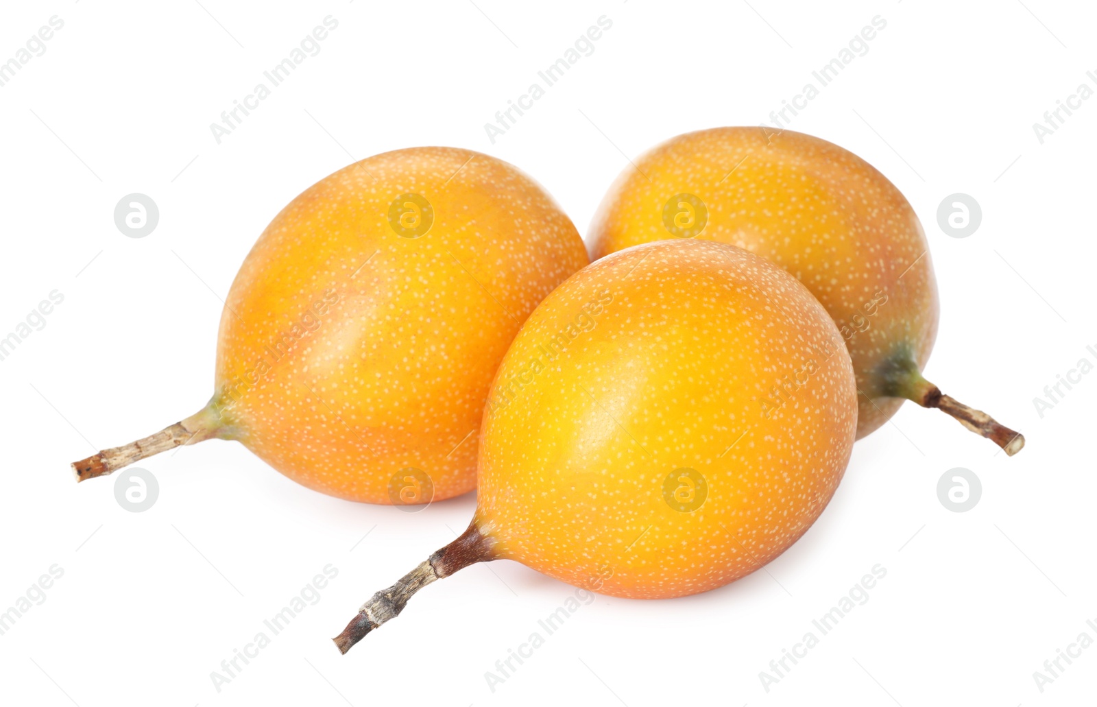 Whole ripe yellow passion fruits isolated on white Photo of Whole ripe yellow passion fruits isolated on white