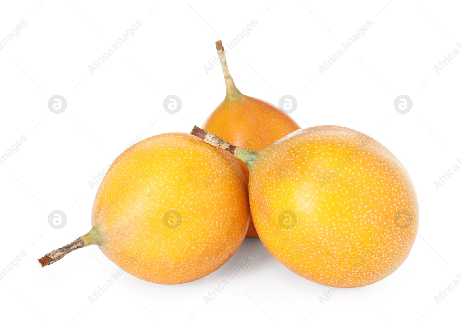 Whole ripe yellow passion fruits isolated on white Photo of Whole ripe yellow passion fruits isolated on white