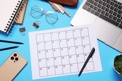 Photo of Planner, stationery, laptop and smartphone on light blue background, flat lay