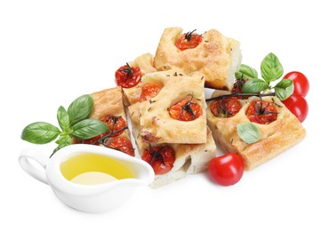 Photo of Pieces of delicious focaccia with tomatoes, spices and oil isolated on white