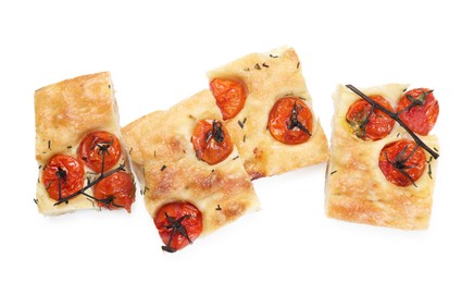 Photo of Pieces of delicious focaccia with tomatoes and spices isolated on white, top view