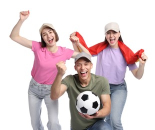 Photo of Emotional sports fans with flag and soccer ball on white background