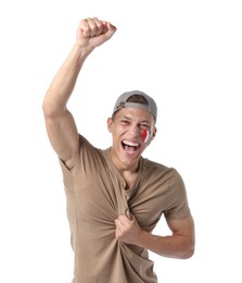 Photo of Emotional sports fan with drawing of Italian flag on white background