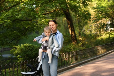 Photo of Mother with her cute baby in park
