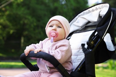 Photo of Cute little baby in stroller at park