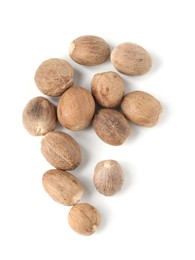 Photo of Fresh nutmegs isolated on white, top view