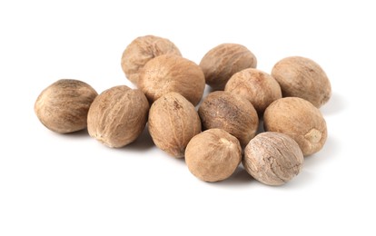 Photo of Pile of fresh nutmegs isolated on white