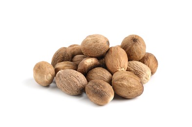 Photo of Pile of fresh nutmegs isolated on white