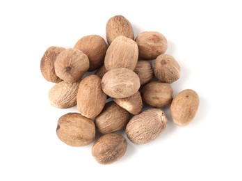 Photo of Fresh nutmegs isolated on white, top view