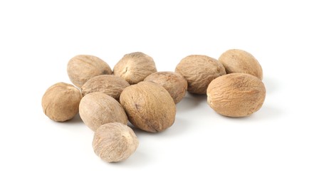 Photo of Pile of fresh nutmegs isolated on white