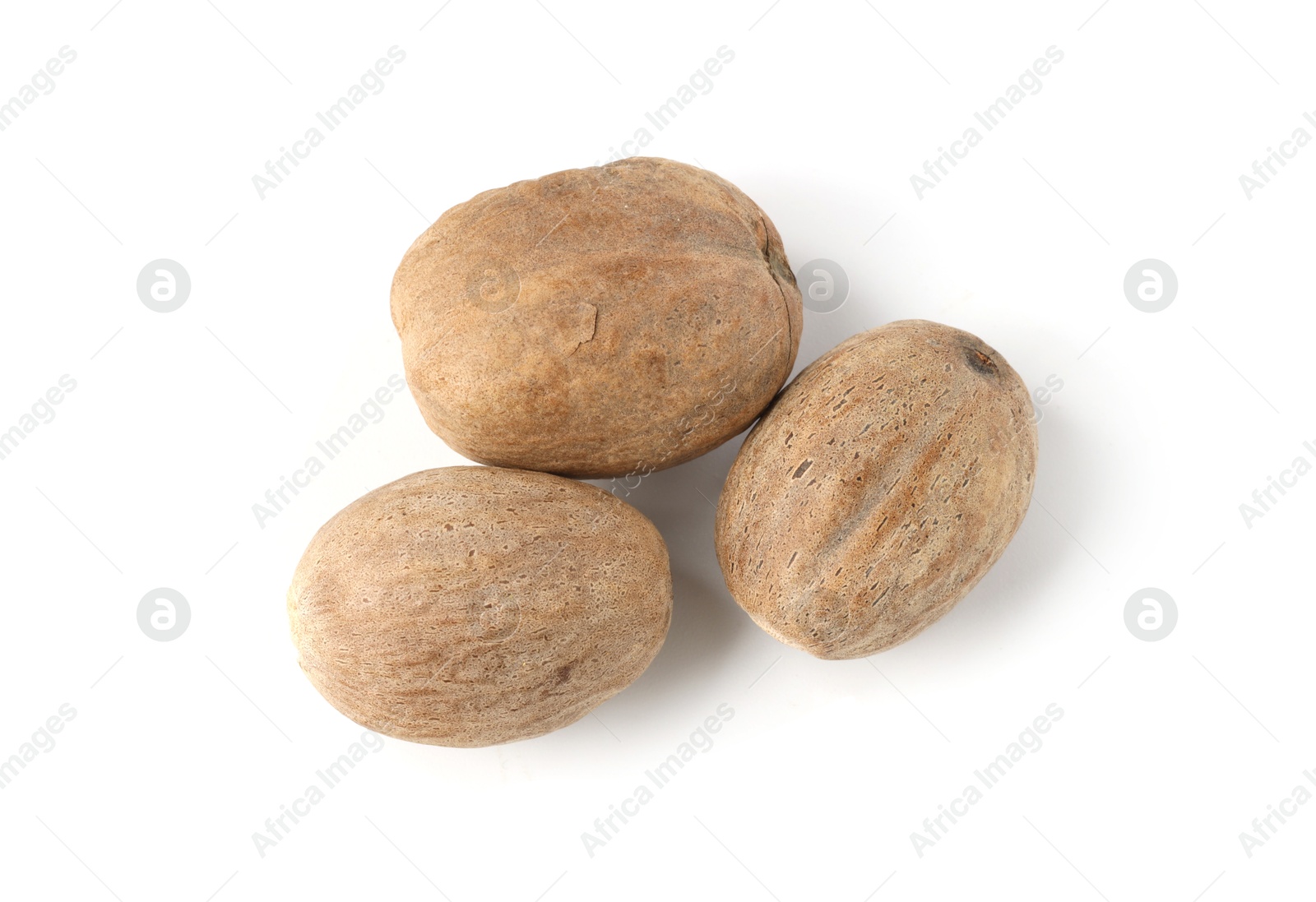 Fresh nutmegs isolated on white, top view Photo of Fresh nutmegs isolated on white, top view