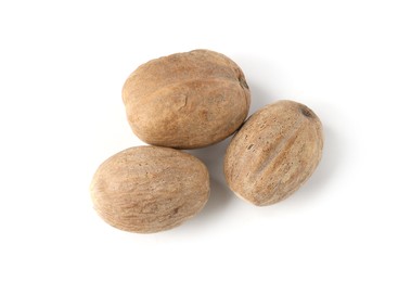Photo of Fresh nutmegs isolated on white, top view