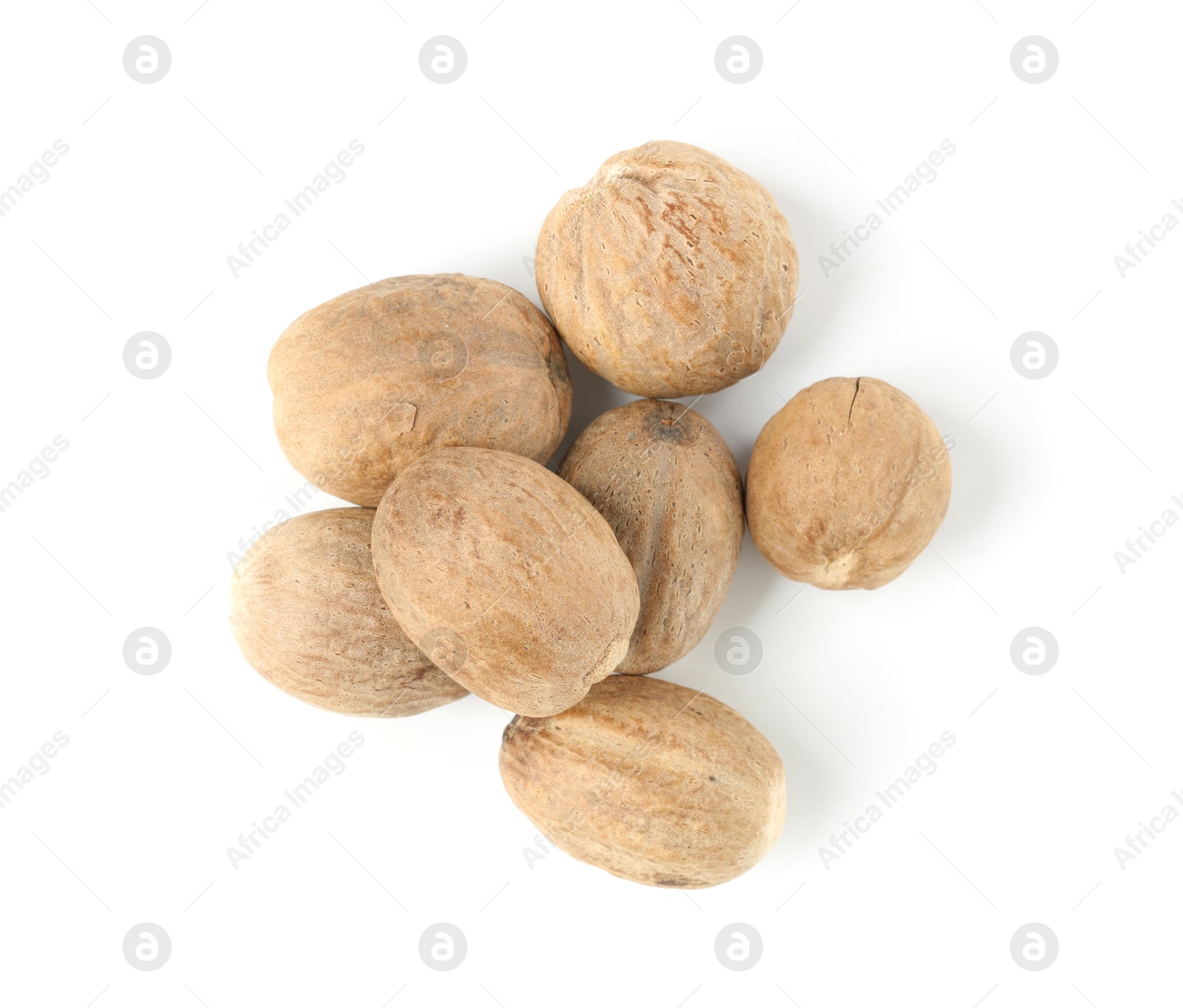 Fresh nutmegs isolated on white, top view Photo of Fresh nutmegs isolated on white, top view