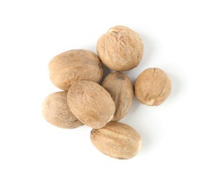 Photo of Fresh nutmegs isolated on white, top view