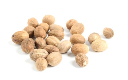 Photo of Pile of fresh nutmegs isolated on white