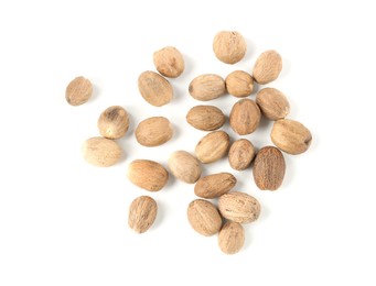 Photo of Fresh nutmegs isolated on white, top view