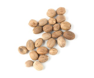 Photo of Fresh nutmegs isolated on white, top view