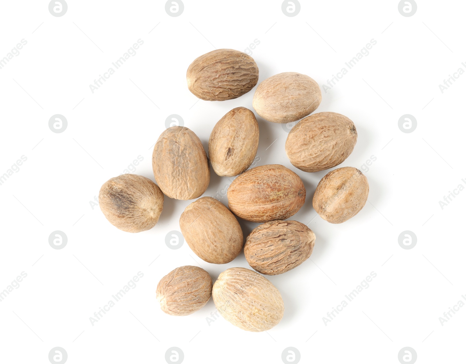 Fresh nutmegs isolated on white, top view Photo of Fresh nutmegs isolated on white, top view