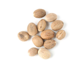 Photo of Fresh nutmegs isolated on white, top view