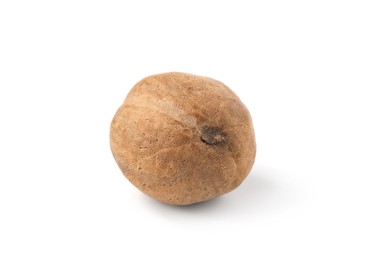 Photo of One whole fresh nutmeg isolated on white