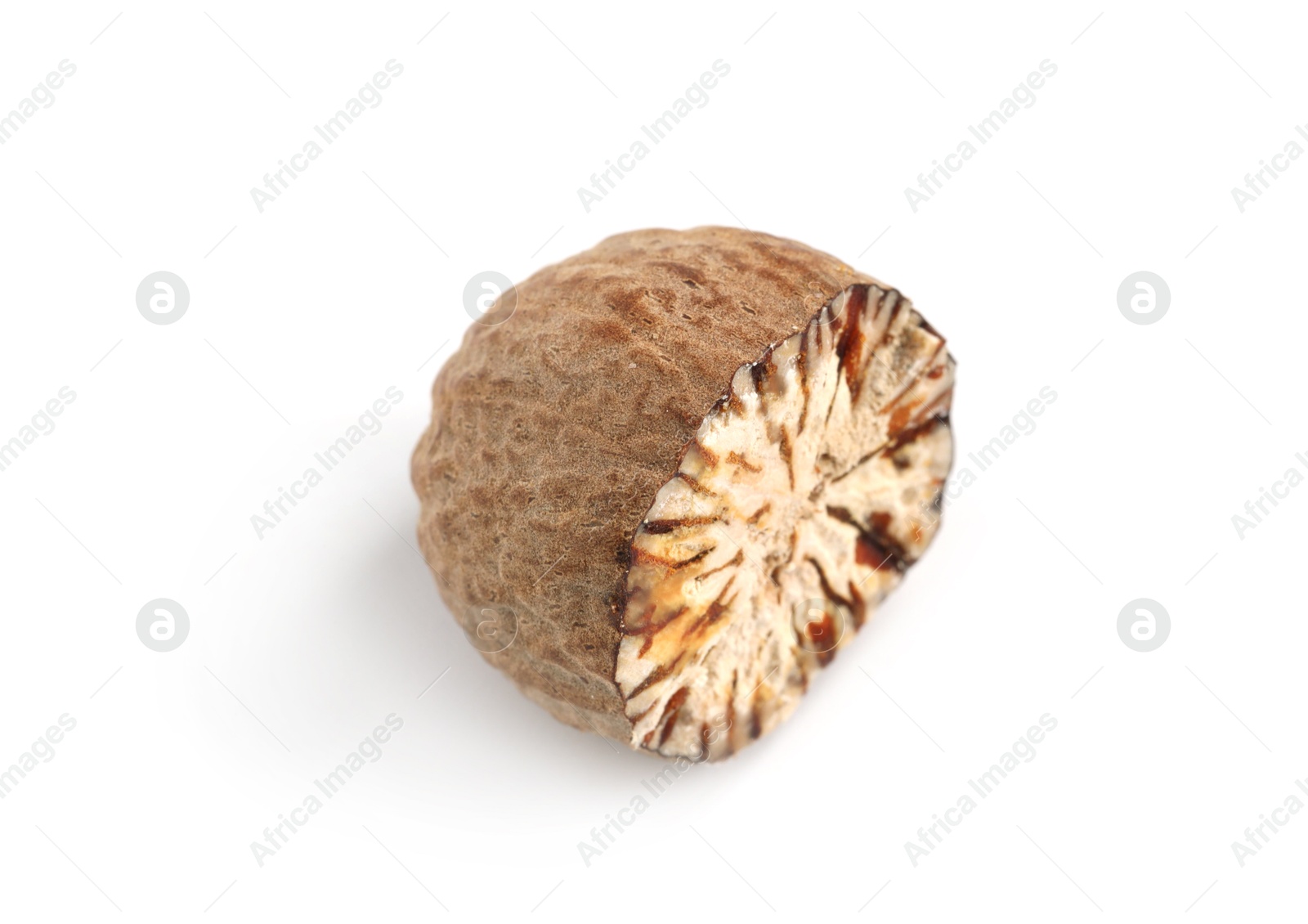 Half of fresh nutmeg isolated on white Photo of Half of fresh nutmeg isolated on white