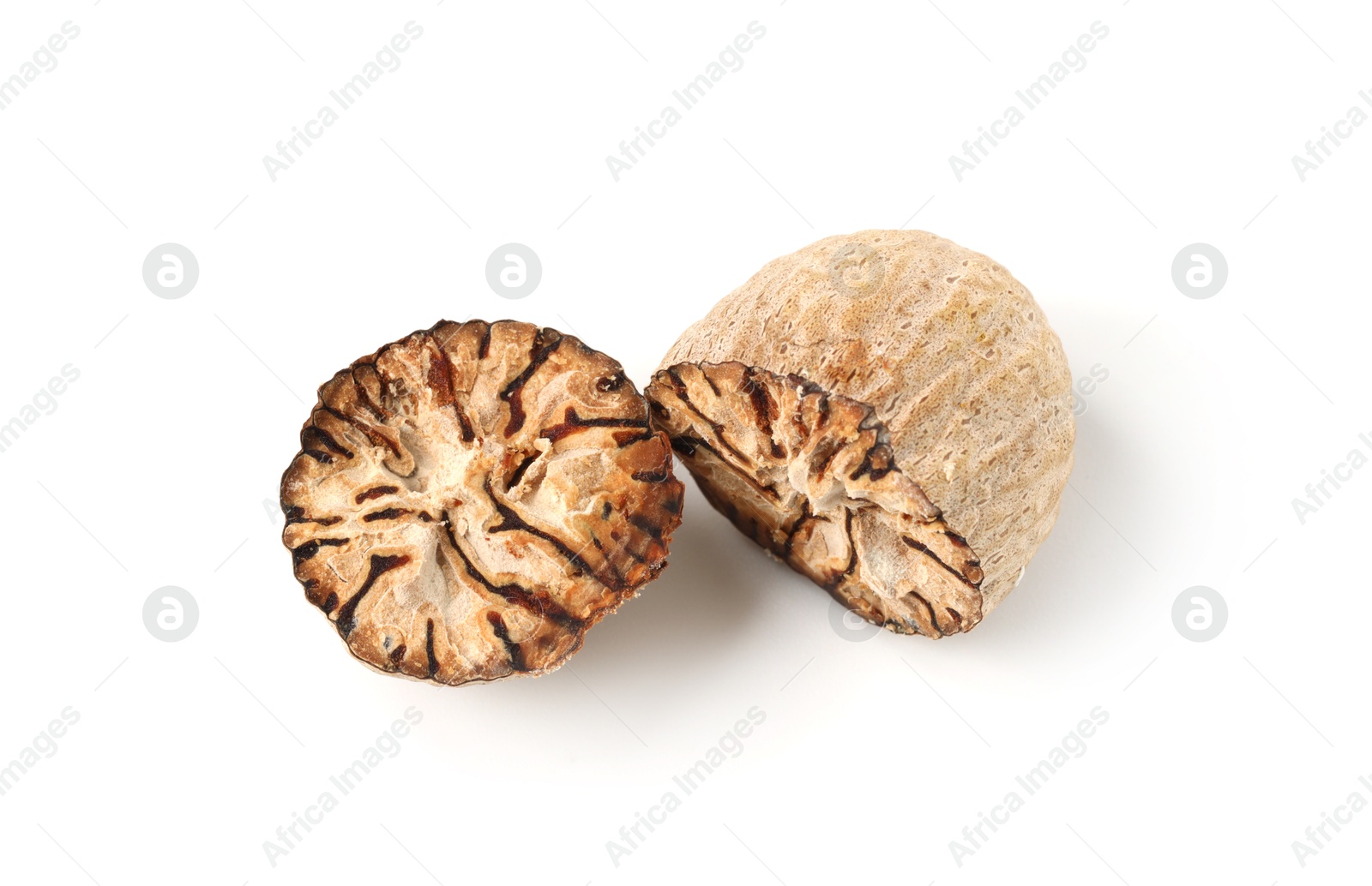 Halves of fresh nutmeg isolated on white, above view Photo of Halves of fresh nutmeg isolated on white, above view