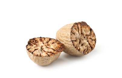 Photo of Halves of fresh nutmeg isolated on white