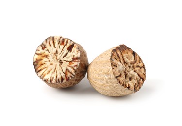 Photo of Halves of fresh nutmeg isolated on white