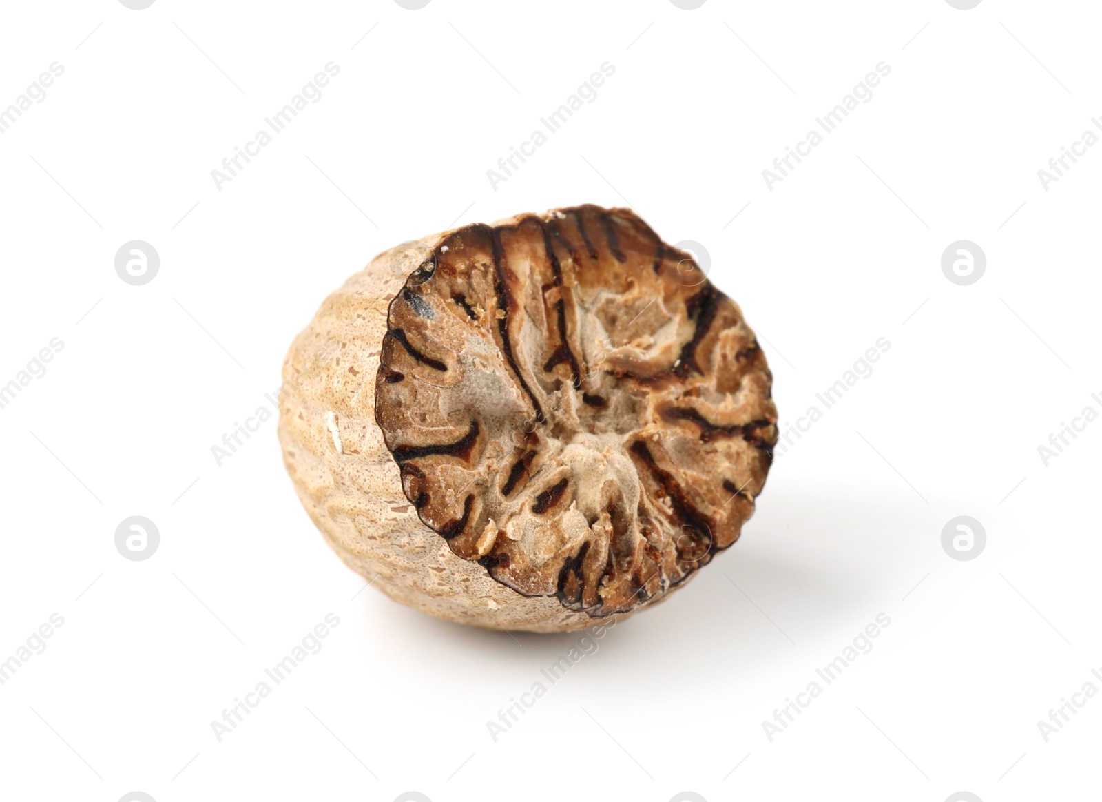 Half of fresh nutmeg isolated on white Photo of Half of fresh nutmeg isolated on white