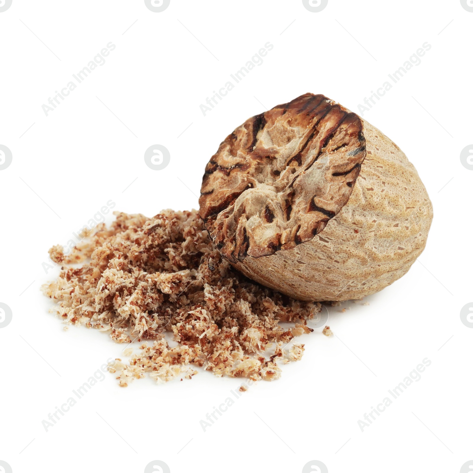 Half of nutmeg and powder isolated on white Photo of Half of nutmeg and powder isolated on white