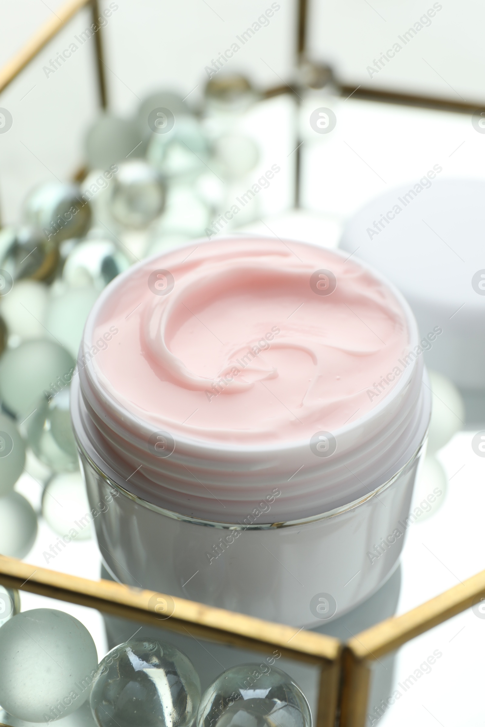 Jar of moisturizing body cream and glass tray on white table, closeup Photo of Jar of moisturizing body cream and glass tray on white table, closeup