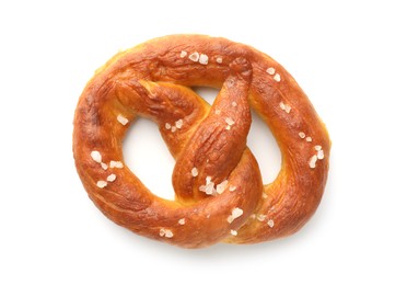 Photo of Tasty pretzel with salt isolated on white, top view