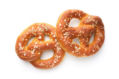 Photo of Tasty pretzels with salt isolated on white, top view