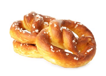 Photo of Tasty pretzels with salt isolated on white