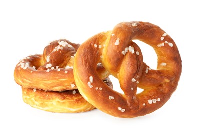 Photo of Tasty pretzels with salt isolated on white