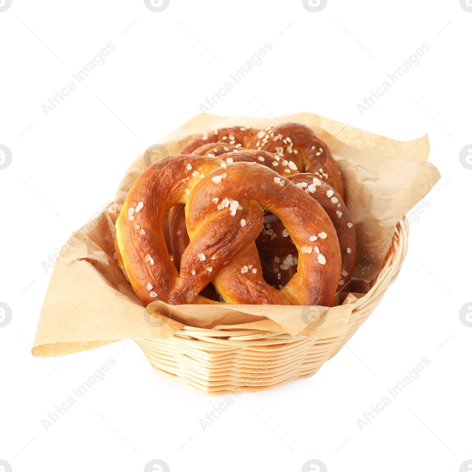 Tasty pretzels with salt in wicker basket isolated on white Photo of Tasty pretzels with salt in wicker basket isolated on white
