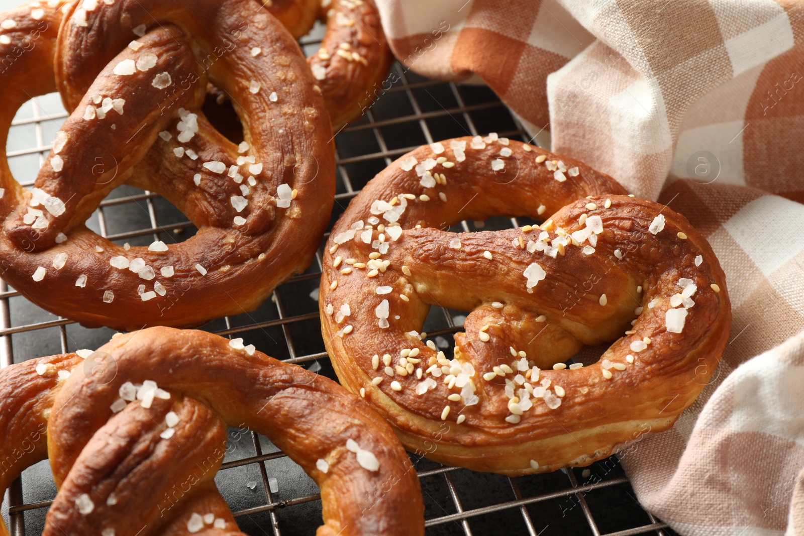 Tasty pretzels with salt on table, closeup Photo of Tasty pretzels with salt on table, closeup