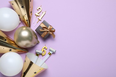 Photo of Beautiful party hats and other festive decor on violet background, flat lay. Space for text
